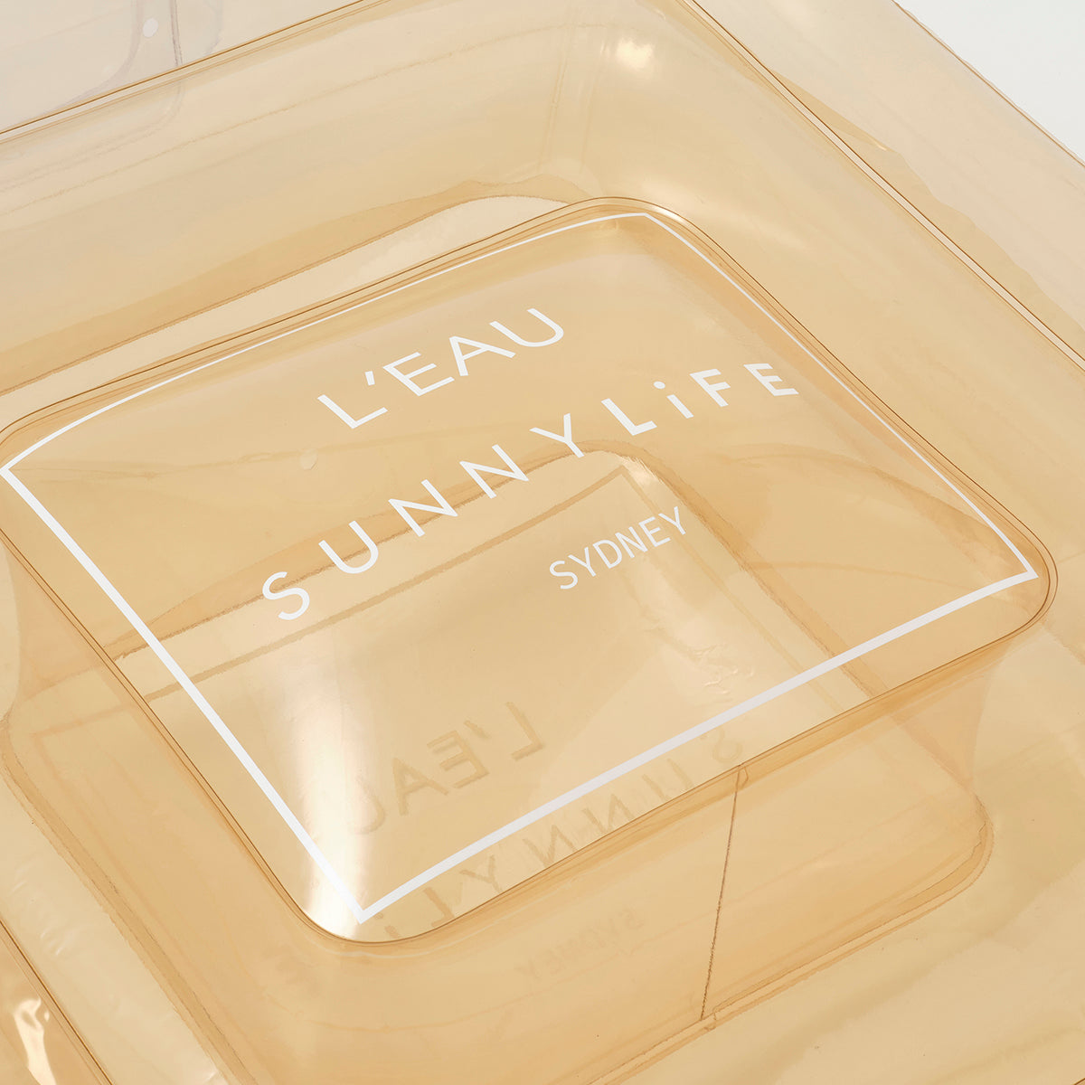 SUNNYLiFE Champagne color inflatable Luxe Lie-On Float Parfum